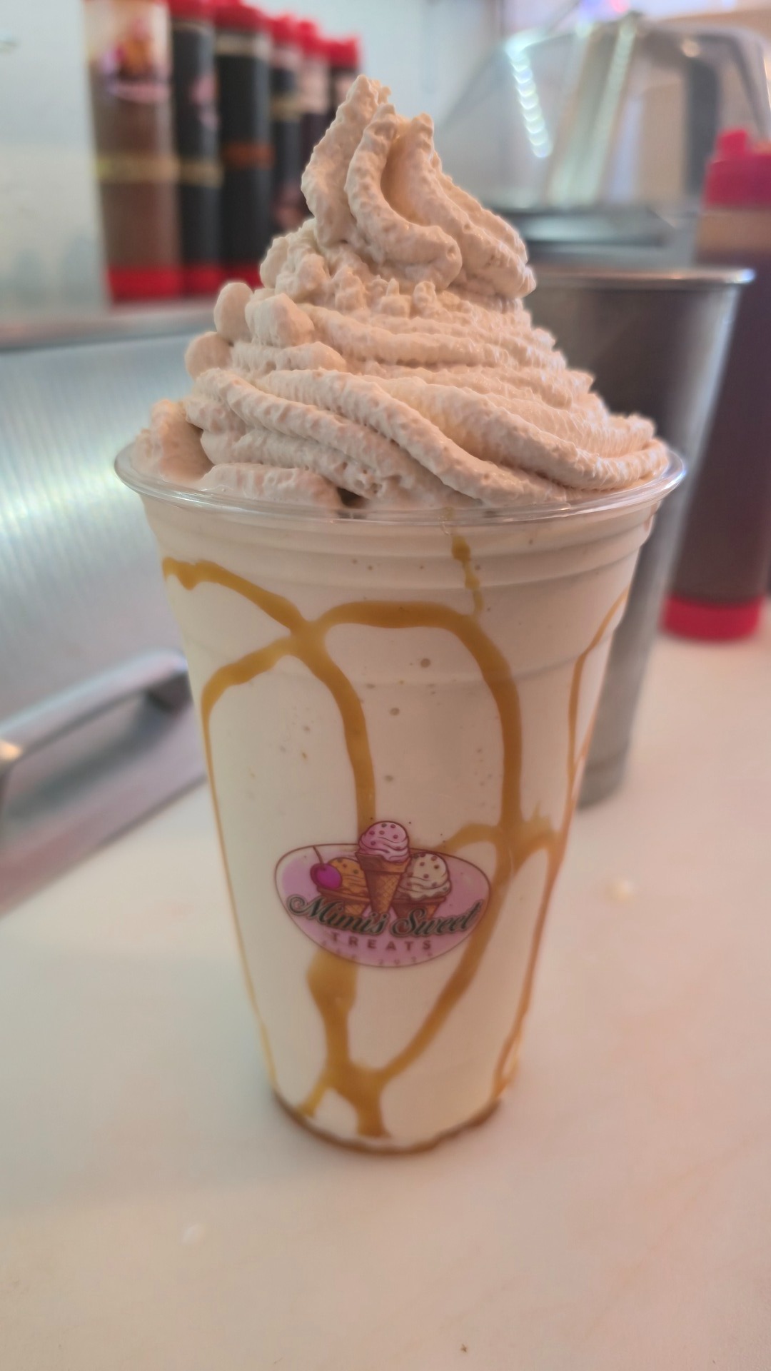Caramel shake in a Mimi's branded cup